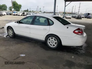 2006 Ford Taurus SE with VIN 1FAHP53U86A237001, listed as a Copart auction lot 62858785 with 133,697 mi miles and Salvage title. Bid and sale history available at DreamBid. Image 2.