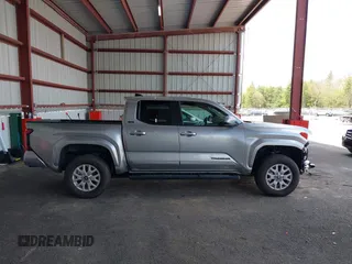 2025 Toyota Tacoma SR with VIN 3TMLB5JN7SM100983, listed as a IAAI auction lot 42220559 with 2,119 mi miles and . Bid and sale history available at DreamBid. Image 14.