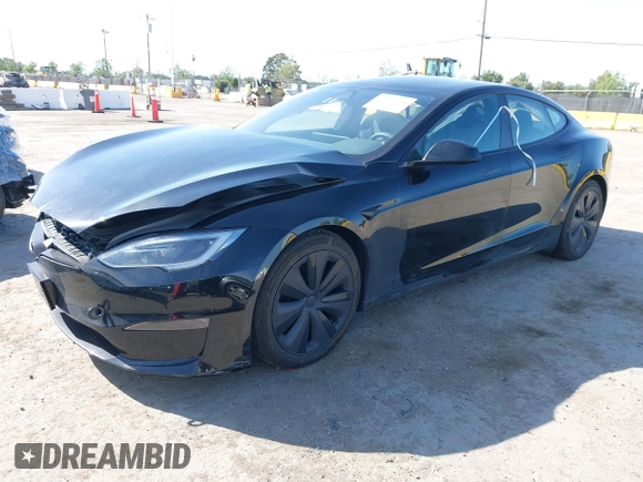2023 Tesla Model S with VIN 5YJSA1E54PF531021, listed as a IAAI auction lot 42014104 with Not provided miles and . Bid and sale history available at DreamBid. Image 19.