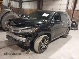 2020 Honda Pilot Touring 7-Passenger with VIN 5FNYF6H63LB032301, listed as a IAAI auction lot 38419333 with 50,433 mi miles and . Bid and sale history available at carsss.com. Image 2.