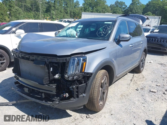 2025 Kia Telluride S with VIN 5XYP64GC6SG622930, listed as a IAAI auction lot 42643647 with 11,056 mi miles and . Bid and sale history available at DreamBid. Image 2.