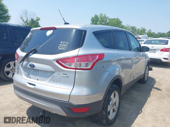 2014 Ford Escape SE with VIN 1FMCU9GX3EUC42964, listed as a IAAI auction lot 42484080 with 124,696 mi miles and . Bid and sale history available at DreamBid. Image 4.