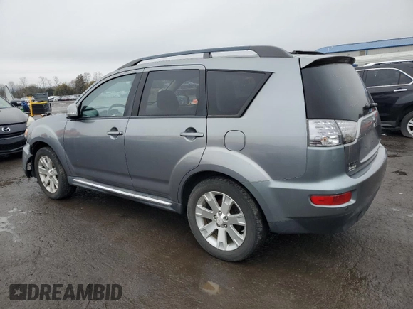 2013 Mitsubishi Outlander SE z VIN JA4JT3AW4DU000656, wystawiony jako Copart lot #51808395 z przebiegiem 158 479 mil mil oraz Szkoda całkowita • Salvage title. Historia ofert i sprzedaży dostępna na DreamBid. Obrazek 2.