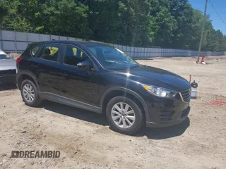 2016 Mazda CX-5 Sport z VIN JM3KE2BY7G0801518, wystawiony jako IAAI lot #42321256 z przebiegiem 56 730 mil mil oraz . Historia ofert i sprzedaży dostępna na DreamBid. Obrazek 1.