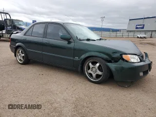 2002 Mazda Protege LX z VIN JM1BJ226920510014, wystawiony jako Copart lot #59285995 z przebiegiem 235 652 mil mil oraz Szkoda całkowita • Salvage title. Historia ofert i sprzedaży dostępna na DreamBid. Obrazek 4.