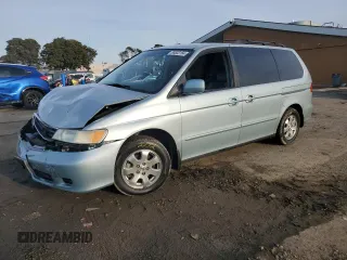 2003 Honda Odyssey EX-L with VIN 2HKRL18743H505441, listed as a Copart auction lot 85802164 with 103,518 mi miles and Salvage title. Bid and sale history available at DreamBid. Image 1.