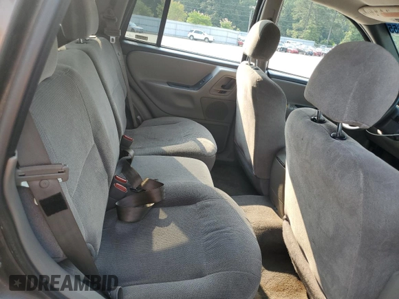 1999 Jeep Grand Cherokee Laredo with VIN 1J4G258S9XC731752, listed as a Copart auction lot 58601555 with 245,284 mi miles and Salvage title. Bid and sale history available at DreamBid. Image 10.