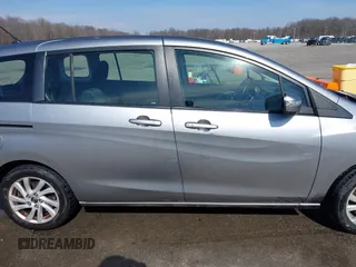 2013 Mazda 5 Sport with VIN JM1CW2BL6D0146696, listed as a IAAI auction lot 41657255 with 142,939 mi miles and . Bid and sale history available at DreamBid. Image 14.
