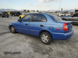2001 Hyundai Accent GL with VIN KMHCG45C91U195735, listed as a Copart auction lot 80950554 with 164,176 mi miles and Salvage Title. Bid and sale history available at carsss.com. Image 2.