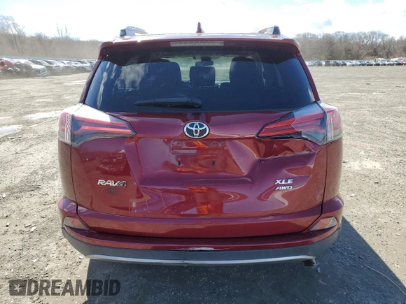 2018 Toyota RAV4 XLE with VIN 2T3RFREVXJW715931, listed as a Copart auction lot 48130715 with 106,324 mi miles and Salvage Title. Bid and sale history available at DreamBid. Image 6.