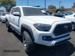 2023 Toyota Tacoma SR with VIN 3TMCZ5AN4PM558760, listed as a IAAI auction lot 42626514 with 39,335 mi miles and . Bid and sale history available at DreamBid. Image 1.