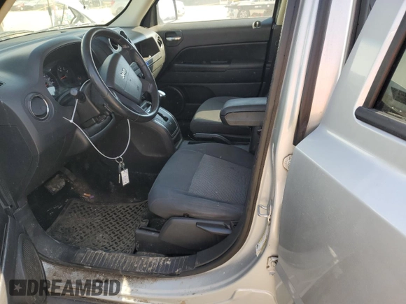 2009 Jeep Patriot Sport with VIN 1J8FT28B59D126503, listed as a Copart auction lot 48994695 with 167,804 mi miles and Salvage Title. Bid and sale history available at DreamBid. Image 7.