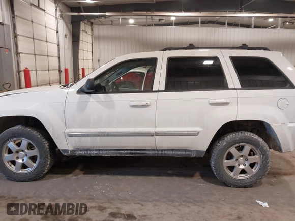 2010 Jeep Grand Cherokee Laredo with VIN 1J4PR4GK7AC126059, listed as a IAAI auction lot 41599058 with 154,192 mi miles. Bid and sale history available at carsss.com. Image 15.