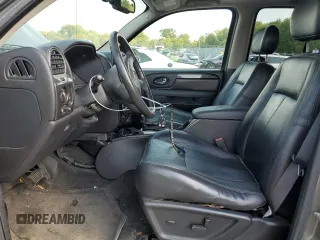 2006 GMC Envoy SLT with VIN 1GKDT13S962305588, listed as a Copart auction lot 69196964 with 118,289 mi miles and Salvage Title. Bid and sale history available at DreamBid. Image 7.