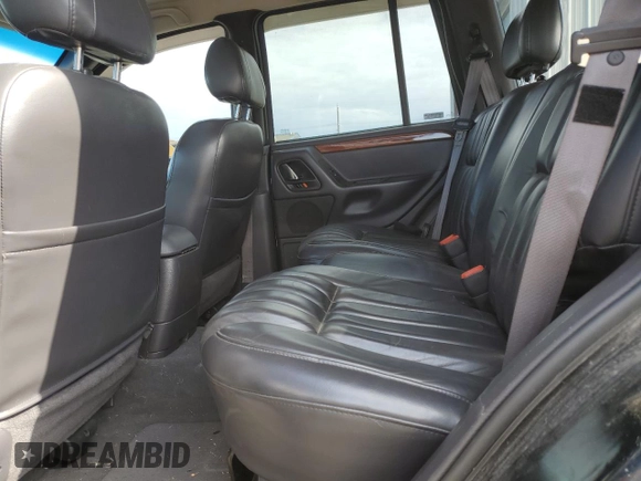1999 Jeep Grand Cherokee Limited with VIN 1J4GW68N4XC679841, listed as a Copart auction lot 59760015 with 155,366 mi miles and Salvage title. Bid and sale history available at DreamBid. Image 11.