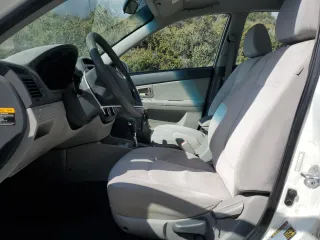 2009 Kia Spectra LX z VIN KNAFE222295640665, wystawiony jako Copart lot #57086945 z przebiegiem 167 640 mil mil oraz Szkoda całkowita • Salvage title. Historia ofert i sprzedaży dostępna na DreamBid. Obrazek 7.