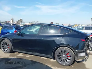 2021 Tesla Model Y Performance with VIN 5YJYGDEF1MF092889, listed as a IAAI auction lot 42076715 with 48,373 mi miles and . Bid and sale history available at DreamBid. Image 14.