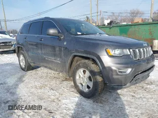 2017 Jeep Grand Cherokee Laredo with VIN 1C4RJFAG7HC876531, listed as a IAAI auction lot 41354471 with 129,056 mi miles. Bid and sale history available at carsss.com. Image 1.
