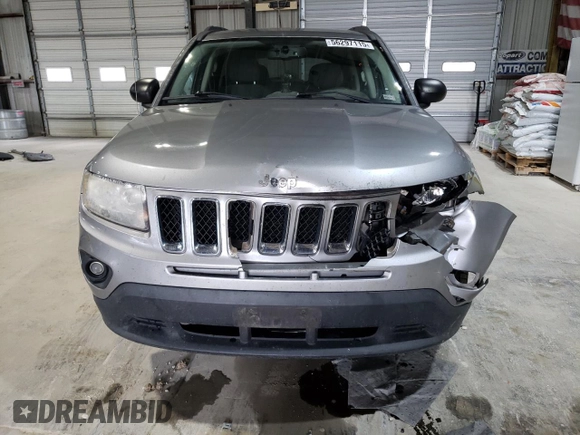 2016 Jeep Compass Sport with VIN 1C4NJCBA1GD512864, listed as a Copart auction lot 56297115 with 216,693 mi miles and Salvage title. Bid and sale history available at DreamBid. Image 5.
