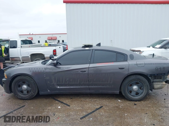 2013 Dodge Charger Police z VIN 2C3CDXAT4DH521778, wystawiony jako IAAI lot #42169438 z przebiegiem 191 907 mil mil oraz . Historia ofert i sprzedaży dostępna na DreamBid. Obrazek 14.