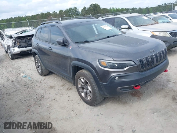 2019 Jeep Cherokee Trailhawk z VIN 1C4PJMBX1KD314121, wystawiony jako IAAI lot #42106721 z przebiegiem 105 631 mil mil oraz . Historia ofert i sprzedaży dostępna na DreamBid. Obrazek 1.