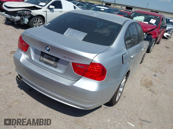 2011 BMW 3 Series 328i with VIN WBAPH7G57BNM58073, listed as a IAAI auction lot 41883231 with 144,539 mi miles. Bid and sale history available at carsss.com. Image 4.
