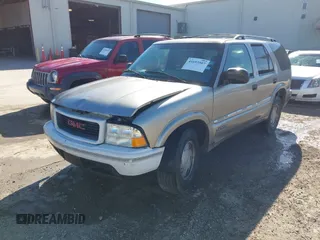 2001 GMC Jimmy SL with VIN 1GKCS13W312204086, listed as a IAAI auction lot 41693507 with 177,439 mi miles. Bid and sale history available at carsss.com. Image 2.