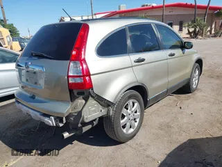 2009 Honda CR-V EX with VIN JHLRE38599C007909, listed as a IAAI auction lot 42077656 with 223,597 mi miles and . Bid and sale history available at carsss.com. Image 4.