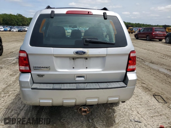 2010 Ford Escape XLS with VIN 1FMCU0C70AKB52226, listed as a Copart auction lot 58241455 with 237,785 mi miles and Salvage title. Bid and sale history available at DreamBid. Image 6.