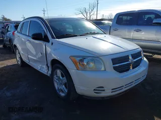 2009 Dodge Caliber SXT with VIN 1B3HB48C29D181709, listed as a IAAI auction lot 41425090 with 147,557 mi miles and . Bid and sale history available at carsss.com. Image 1.