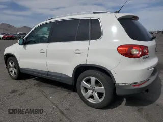 2010 Volkswagen Tiguan Wolfsburg Edition with VIN WVGAV7AX7AW003188, listed as a Copart auction lot 56692535 with 121,502 mi miles and Salvage title. Bid and sale history available at DreamBid. Image 2.