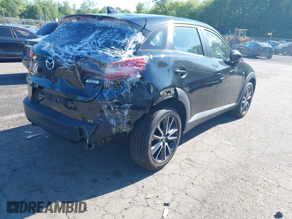 2018 Mazda CX-3 Touring z VIN JM1DKFC73J0321605, wystawiony jako IAAI lot #42355269 z przebiegiem 40 053 mil mil oraz . Historia ofert i sprzedaży dostępna na DreamBid. Obrazek 4.