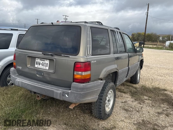 1996 Jeep Grand Cherokee Laredo with VIN 1J4GZ58S9TC161645, listed as a Copart auction lot 85896144 with 0 mi miles and Clean Title. Bid and sale history available at carsss.com. Image 4.