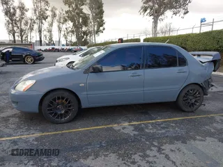 2004 Mitsubishi Lancer ES with VIN JA3AJ26E54U054570, listed as a IAAI auction lot 41592397 with 220,140 mi miles. Bid and sale history available at carsss.com. Image 14.