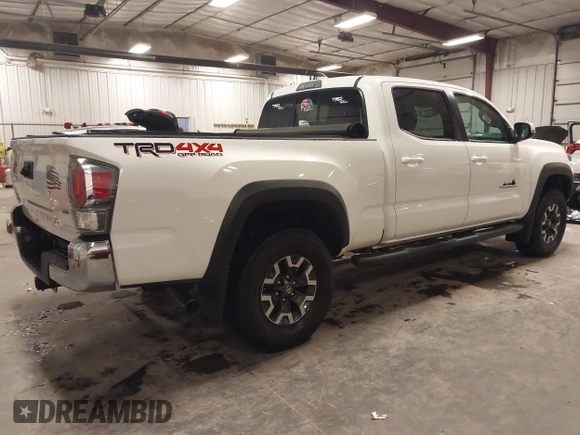 2021 Toyota Tacoma 4WD SR5 with VIN 3TMDZ5BN6MM113743, listed as a IAAI auction lot 41413775 with 24,735 mi miles. Bid and sale history available at carsss.com. Image 4.