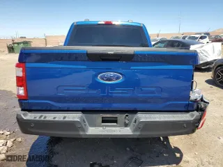 2023 Ford F-150 XL with VIN 1FTEW1CB6PKD83299, listed as a Copart auction lot 67133984 with 14,693 mi miles and Salvage Title. Bid and sale history available at carsss.com. Image 6.