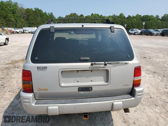 1998 Jeep Grand Cherokee Limited with VIN 1J4GZ78Y5WC324828, listed as a Copart auction lot 58992125 with 225,705 mi miles and Salvage title. Bid and sale history available at DreamBid. Image 6.
