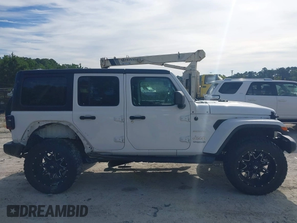 2018 Jeep Wrangler Unlimited Sahara z VIN 1C4HJXEG4JW220092, wystawiony jako IAAI lot #40522478 z przebiegiem 90 529 mil mil oraz . Historia ofert i sprzedaży dostępna na DreamBid. Obrazek 13.