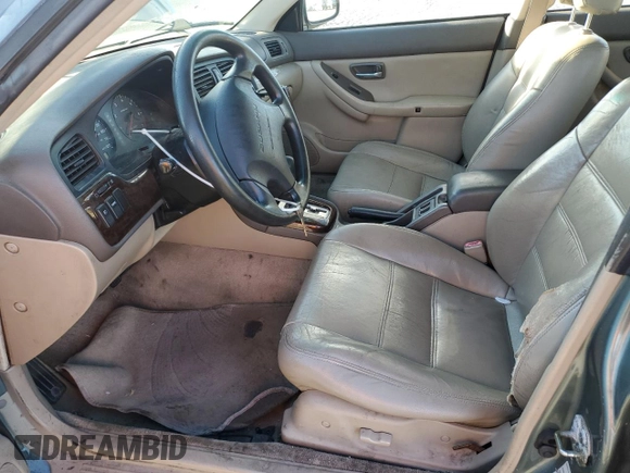 2000 Subaru Legacy Outback with VIN 4S3BH6657Y7620094, listed as a Copart auction lot 48182655 with 296,942 mi miles and Salvage title. Bid and sale history available at DreamBid. Image 7.