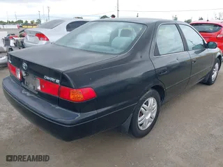 2000 Toyota Camry CE with VIN JT2BG22KXY0499280, listed as a IAAI auction lot 42075329 with 321,420 mi miles. Bid and sale history available at carsss.com. Image 4.