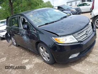 2012 Honda Odyssey Touring with VIN 5FNRL5H91CB121950, listed as a IAAI auction lot 42456620 with 200,831 mi miles and . Bid and sale history available at DreamBid. Image 1.