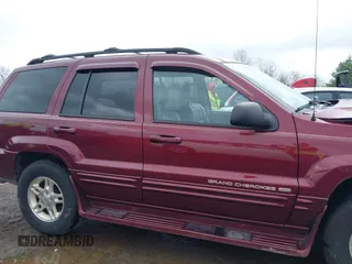 1999 Jeep Grand Cherokee Limited with VIN 1J4GW68N5XC642670, listed as a IAAI auction lot 41990199 with 154,492 mi miles. Bid and sale history available at carsss.com. Image 14.