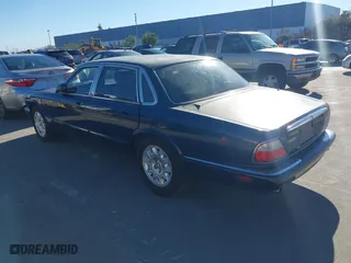 2000 Jaguar XJ with VIN SAJDA14C4YLF16529, listed as a IAAI auction lot 41387819 with 90,143 mi miles. Bid and sale history available at carsss.com. Image 3.
