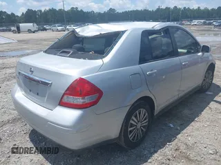 2011 Nissan Versa S with VIN 3N1BC1AP4BL446596, listed as a IAAI auction lot 42425302 with 141,047 mi miles and . Bid and sale history available at DreamBid. Image 4.