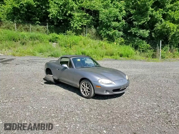 2002 Mazda MX-5 Miata Cloth z VIN JM1NB353520224582, wystawiony jako Copart lot #63669835 z przebiegiem 88 455 mil mil oraz Szkoda całkowita • Salvage title. Historia ofert i sprzedaży dostępna na DreamBid. Obrazek 13.