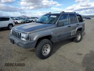 1998 Jeep Grand Cherokee Laredo with VIN 1J4GZ58S7WC316522, listed as a Copart auction lot 80201994 with 217,465 mi miles and Clean Title. Bid and sale history available at carsss.com. Image 1.