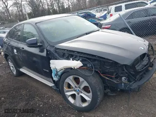 2011 BMW X6 35i with VIN 5UXFG2C58BLX08487, listed as a IAAI auction lot 41627394 with 999,999 mi miles. Bid and sale history available at carsss.com. Image 1.
