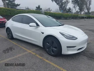 2020 Tesla Model 3 Long Range with VIN 5YJ3E1EB0LF803217, listed as a IAAI auction lot 41871940 with 130,391 mi miles. Bid and sale history available at carsss.com. Image 1.