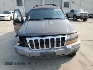 1999 Jeep Grand Cherokee Laredo with VIN 1J4G258S9XC731752, listed as a Copart auction lot 58601555 with 245,284 mi miles and Salvage title. Bid and sale history available at DreamBid. Image 5.