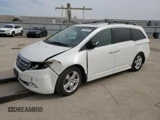 2012 Honda Odyssey Touring with VIN 5FNRL5H98CB135523, listed as a Copart auction lot 42241145 with Not provided miles and Salvage title. Bid and sale history available at DreamBid. Image 1.